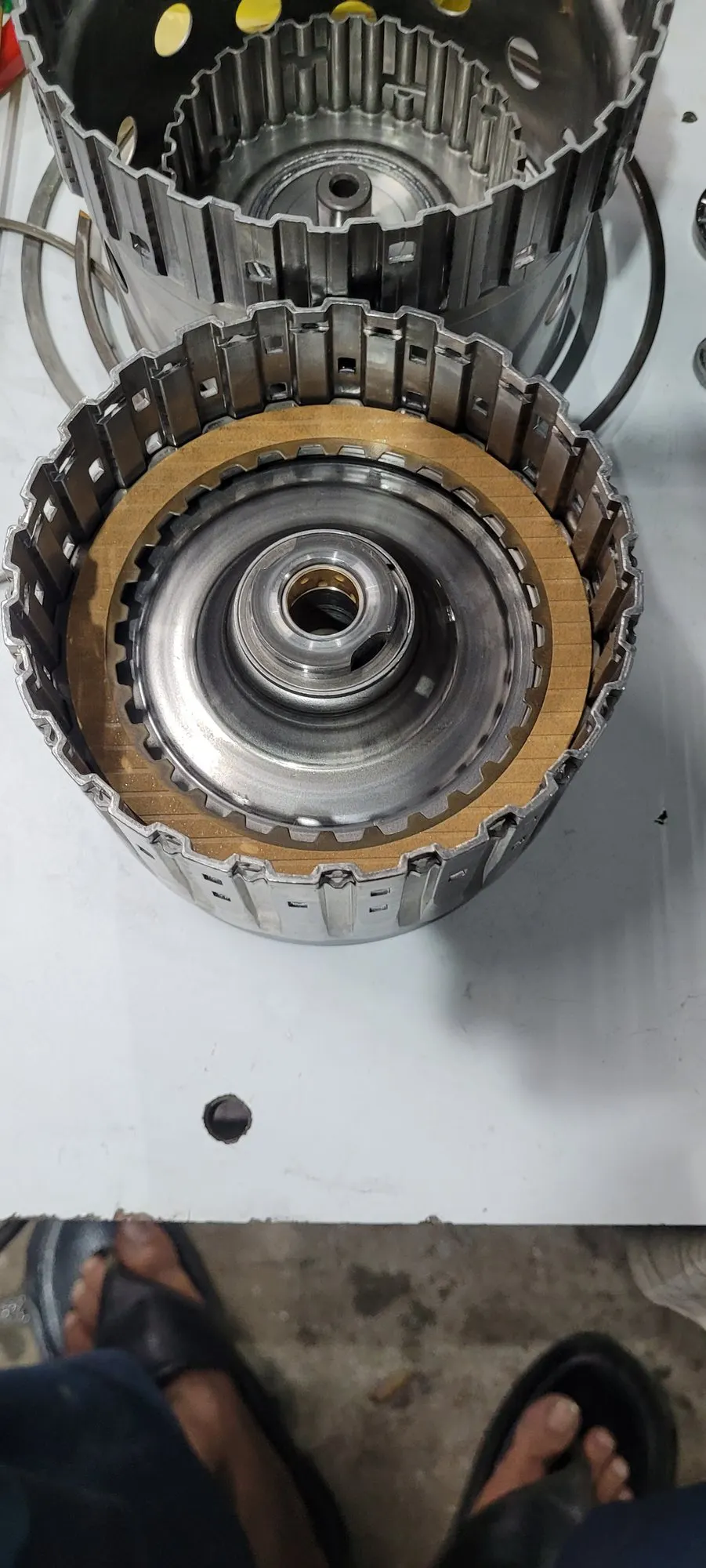 Two clutch drums stacked for inspection