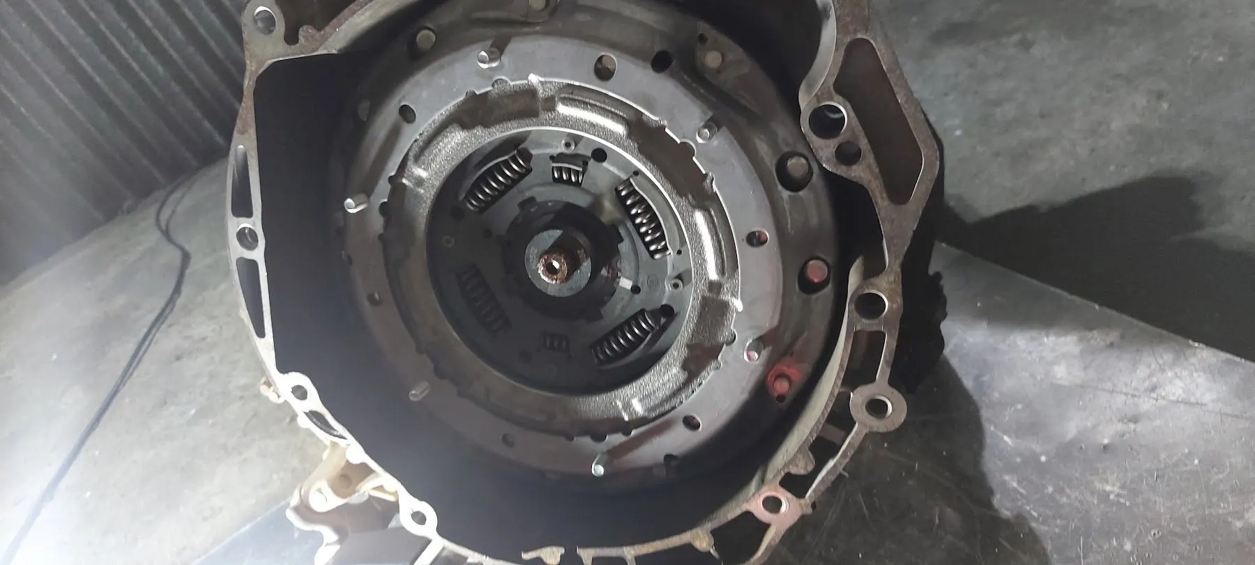 Dual-clutch pack seated in the bell housing of a luxury car gearbox