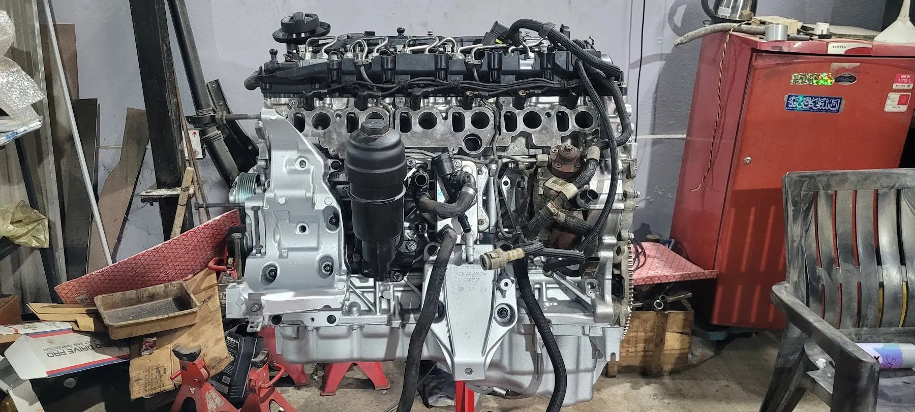 Engine on a stand inside the India Automobiles workshop