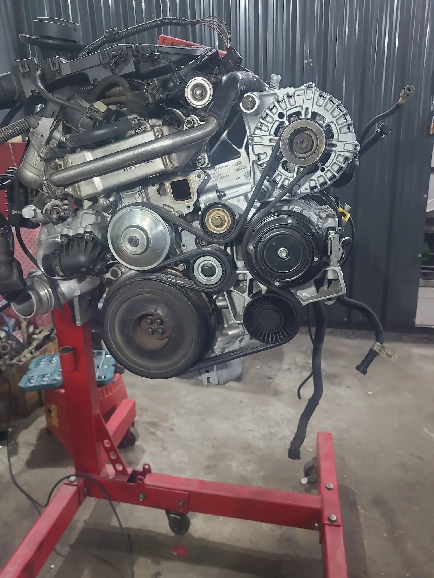 Rebuilt engine mounted on an engine stand