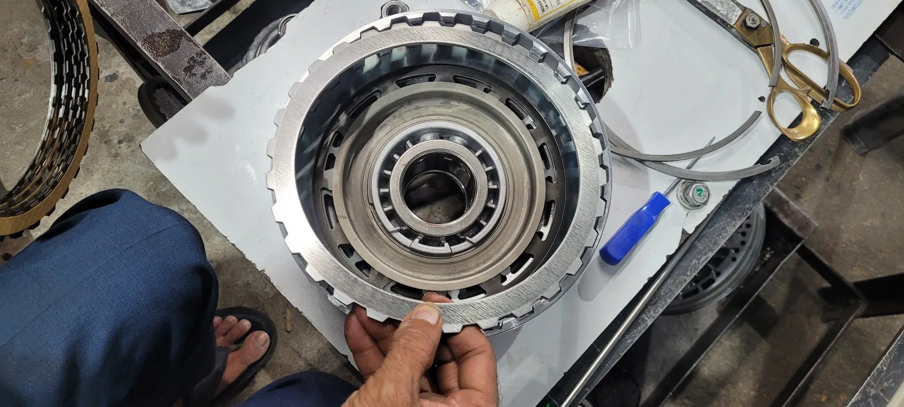 Friction drum checked by hand before reassembly