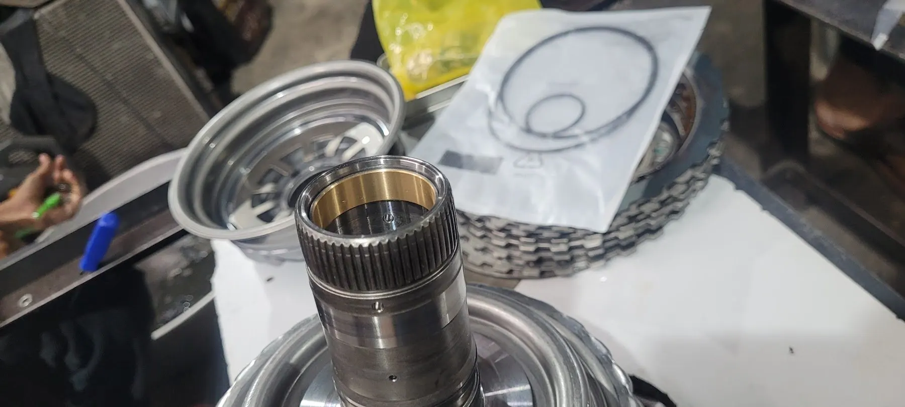Output shaft and bushing with a new seal kit alongside